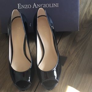 Open toe black patent leather pumps